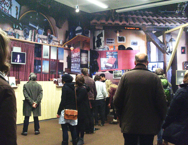 group of people at exhibit looking at the displays