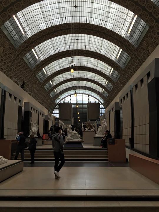 a man is walking through a large open space