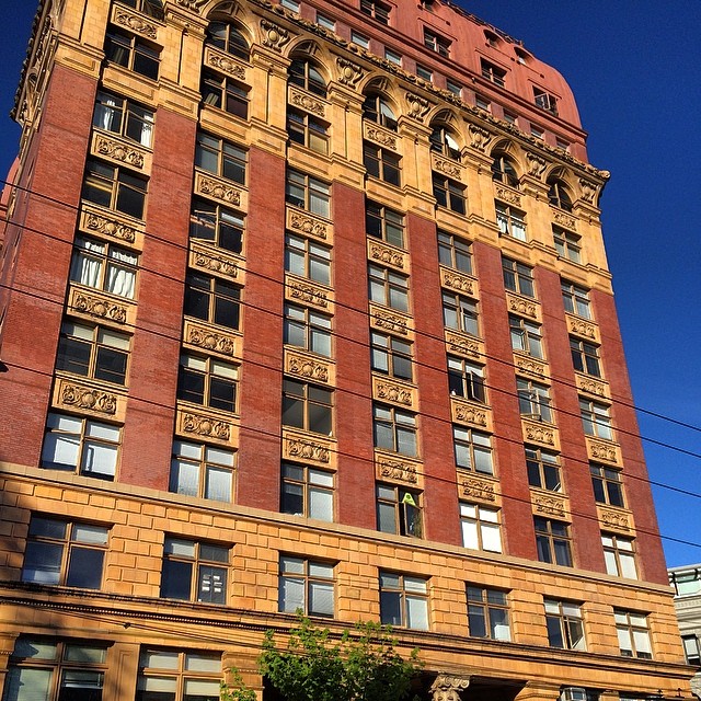 there is a very tall red brick building