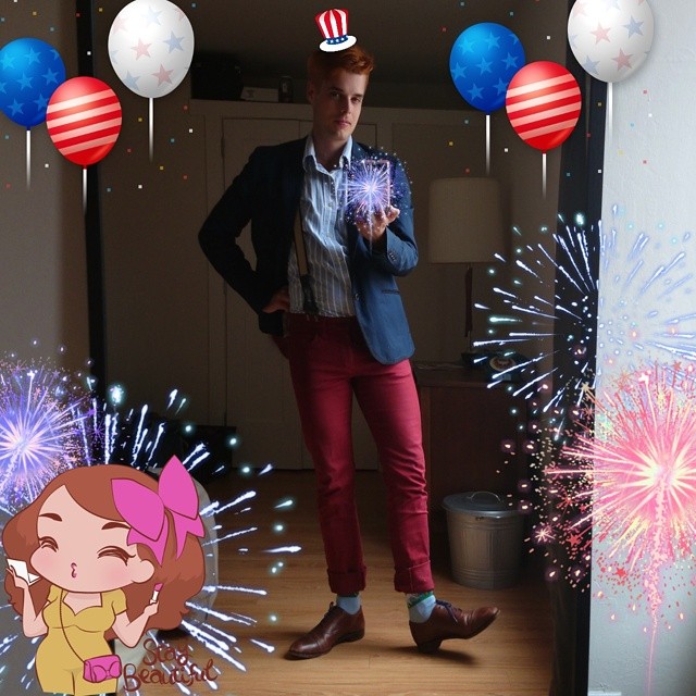 a man in red pants and a fireworks display