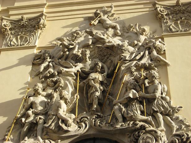 a ornate building with statues and a clock