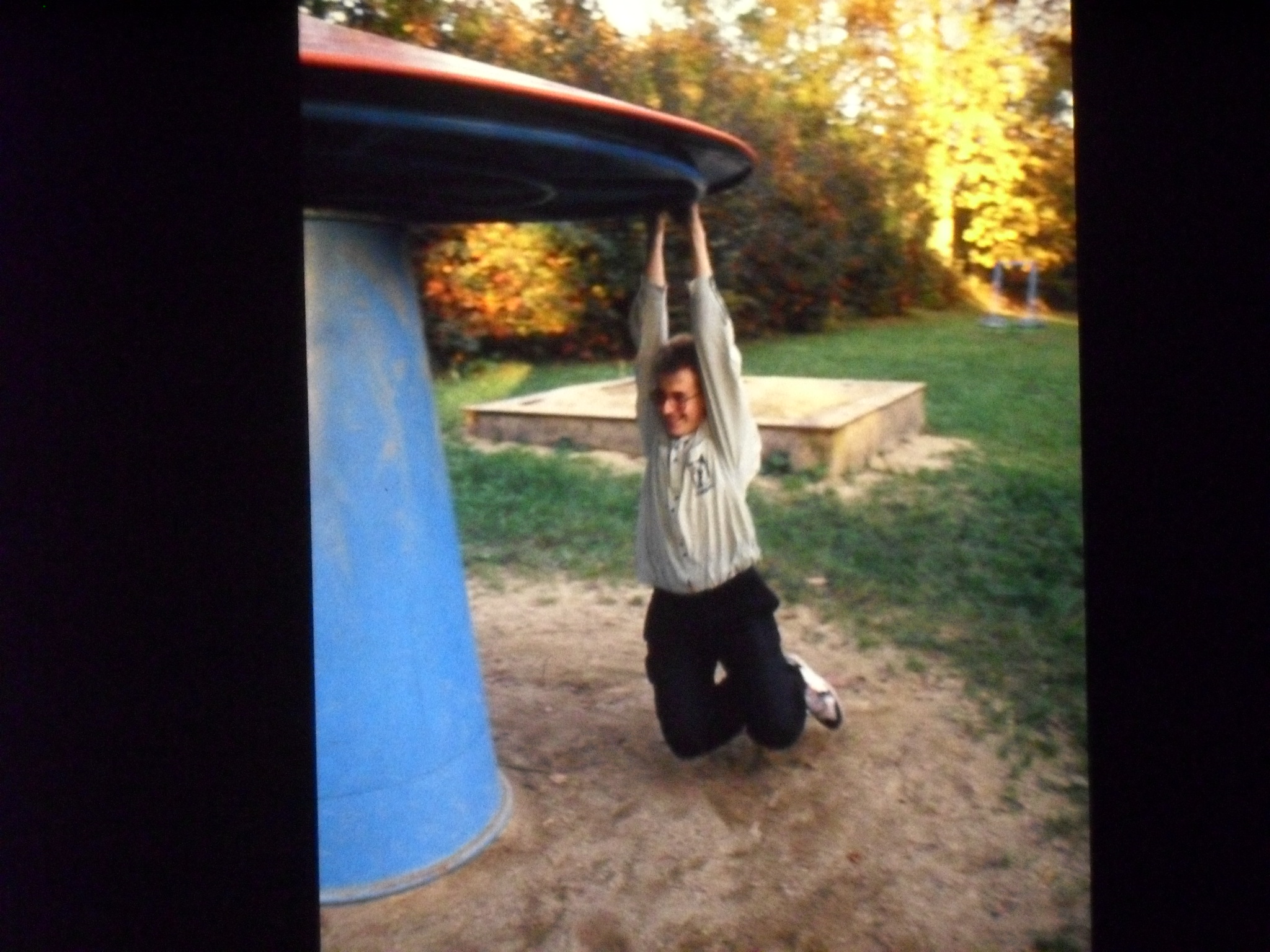 a man lifting his arms in the air