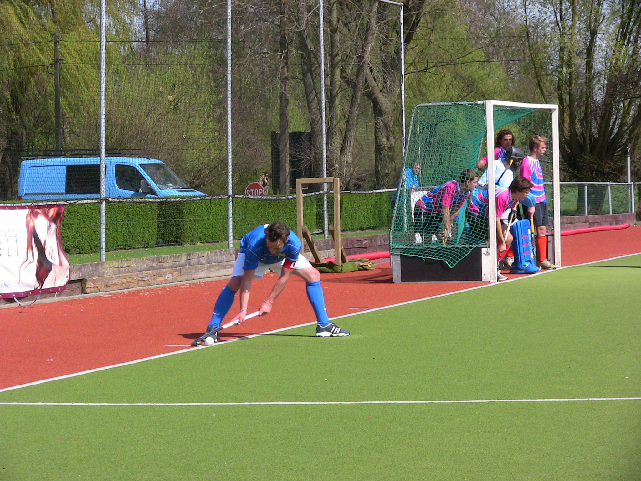 two women on a tennis court playing in the sun