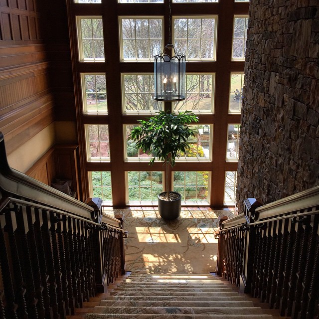 a staircase that leads up to a massive stone wall