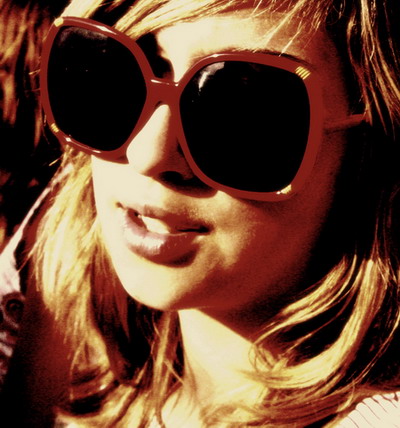 a closeup of a woman wearing sunglasses