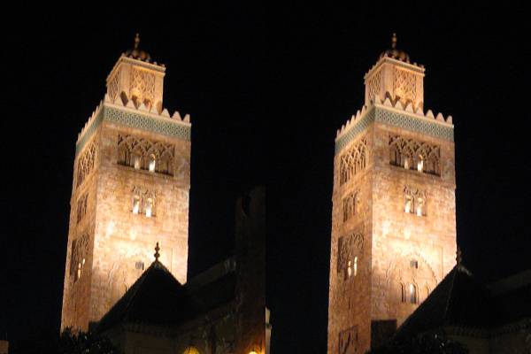 large clock towers lit up in the night sky