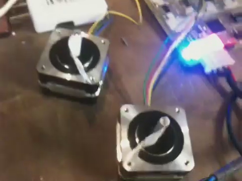 an image of some small speakers that have wires coming out of it