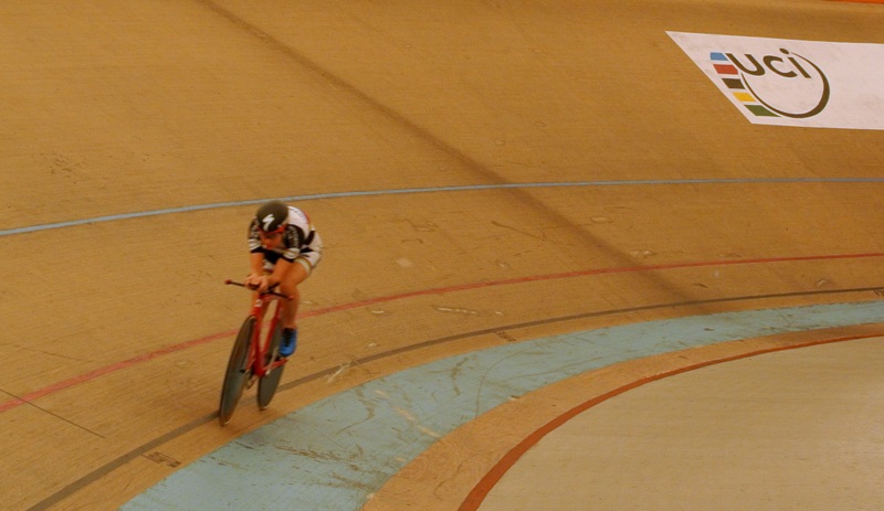 a person on a bike going around a track