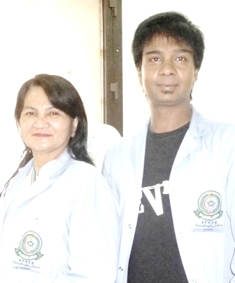 man and woman standing with lab coats on