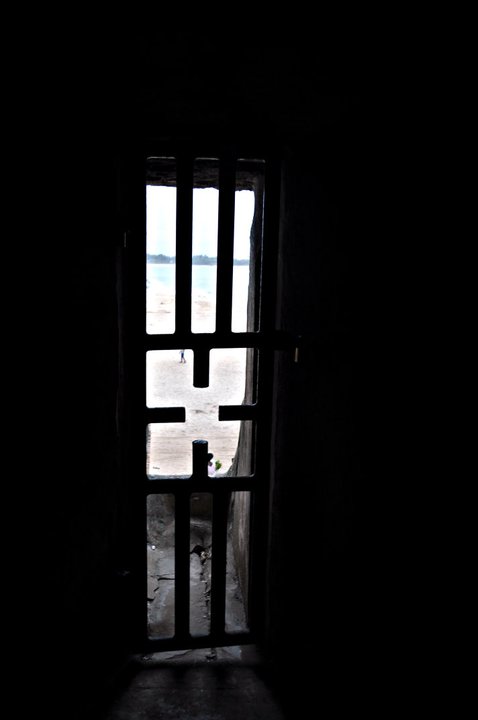 an open window in a dark room with a view