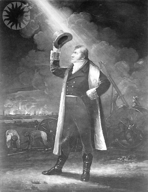 a man in uniform holding up a light