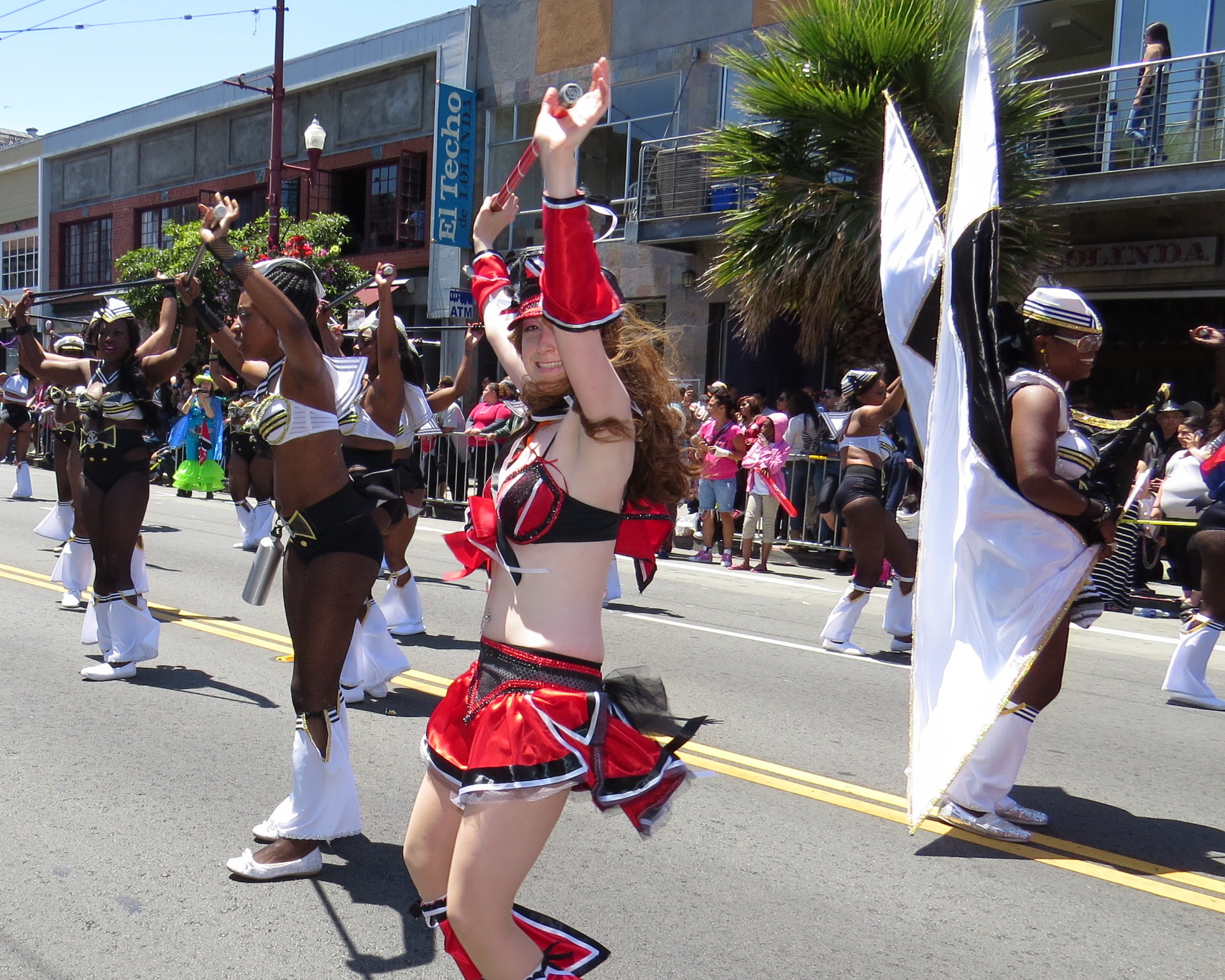 some people are in the street performing an elaborate parade