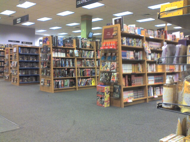 the inside of a store full of books and games