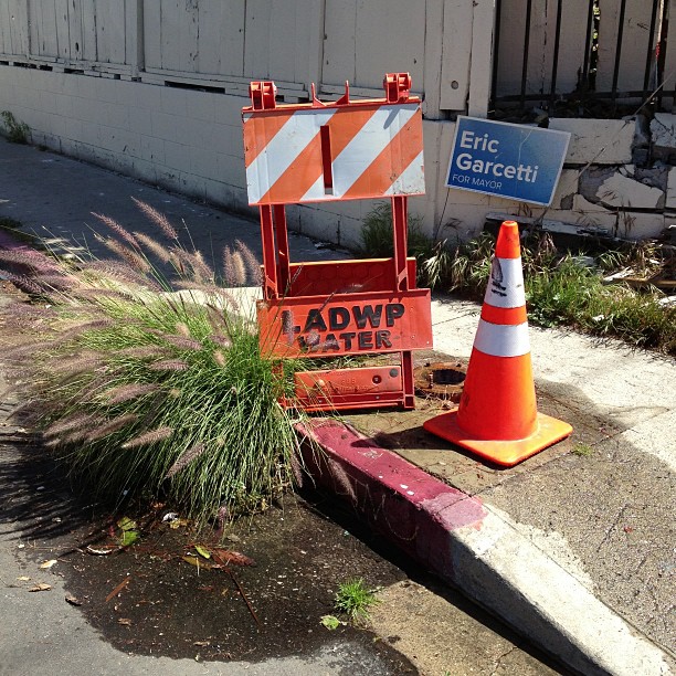 some traffic cones on the side of a road