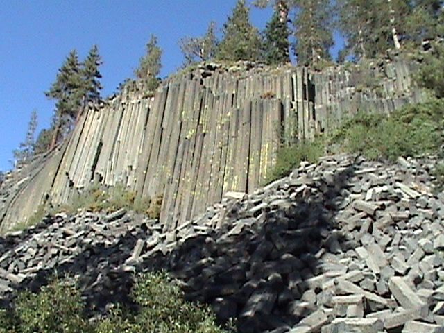 the tall rock cliff is very steep