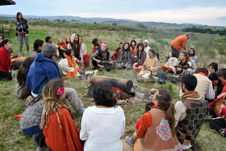 a group of people gathered in a grassy area