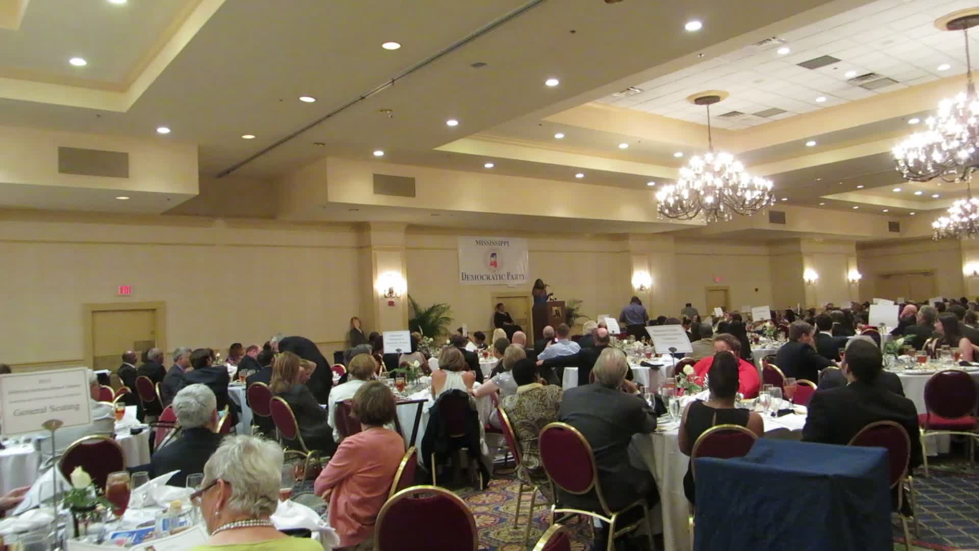 a large crowd of people in a banquet hall