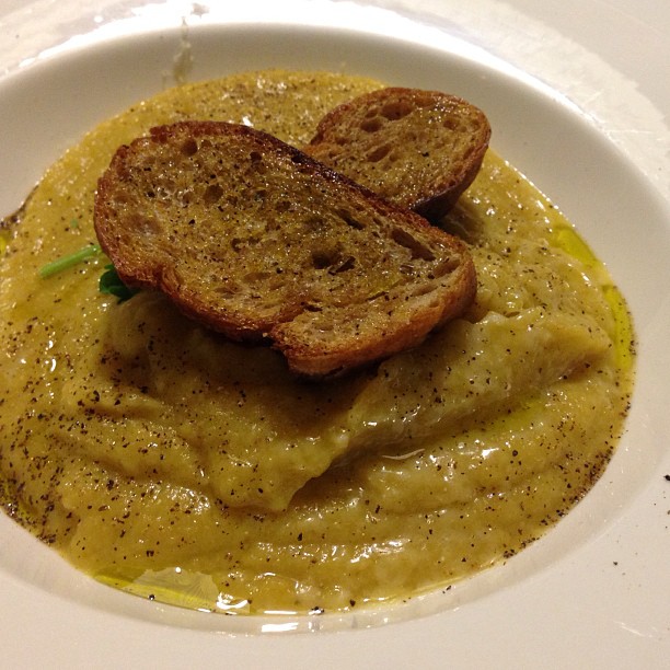 a white plate with some bread on top of it