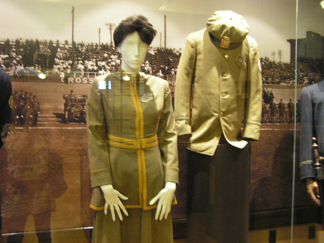 a museum display with uniforms on mannes