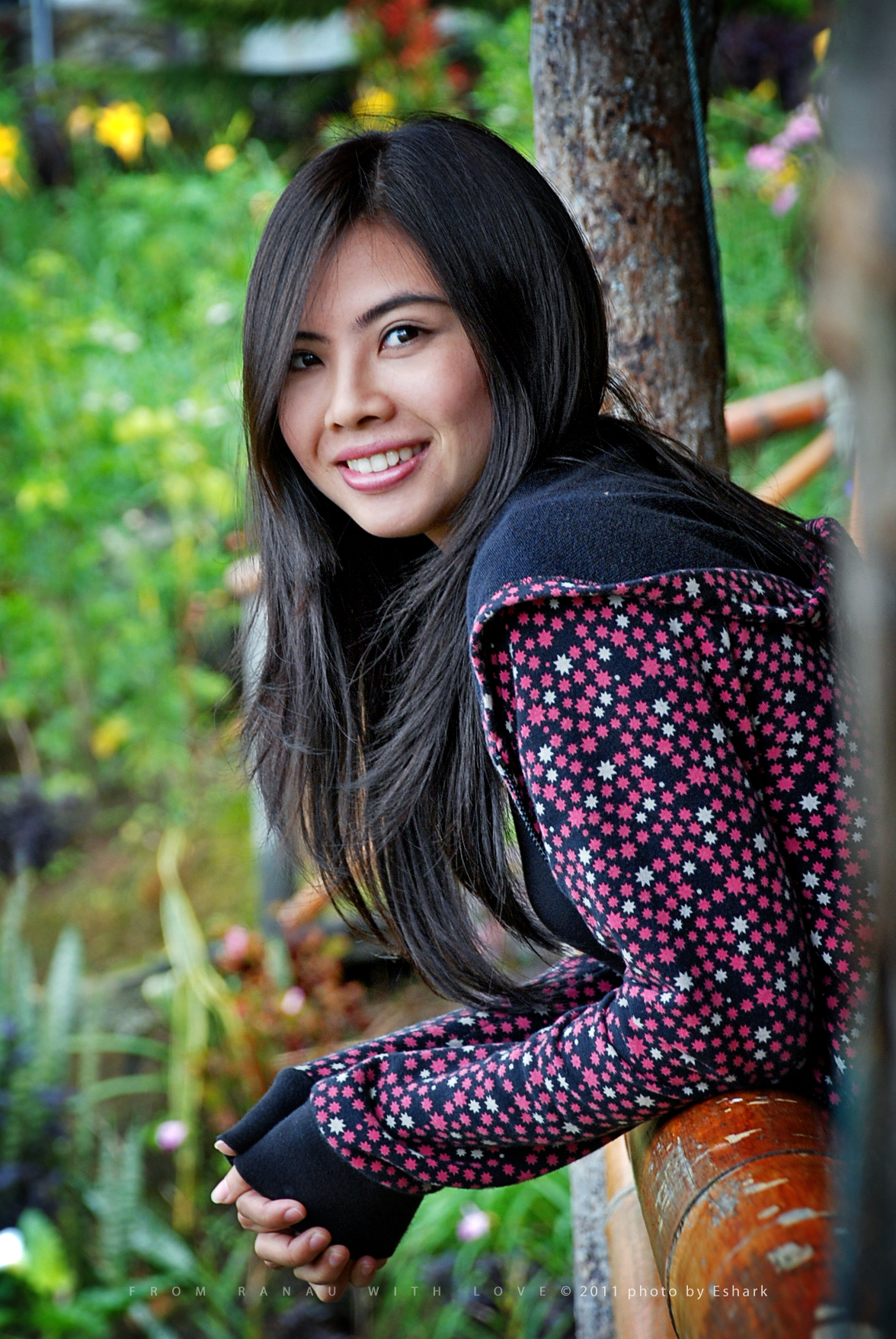 a girl poses for a po in the woods