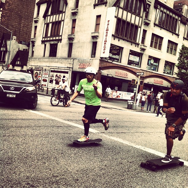 a couple of people that are riding skateboards