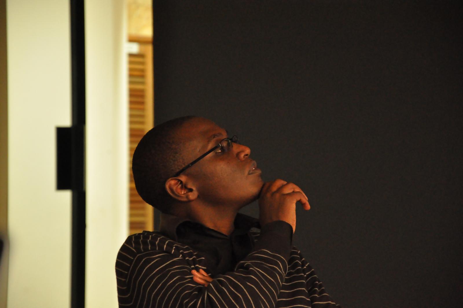 a woman is standing up in the corner of a room