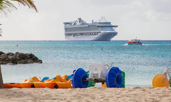 beach toys are arranged around a wheel on the sand