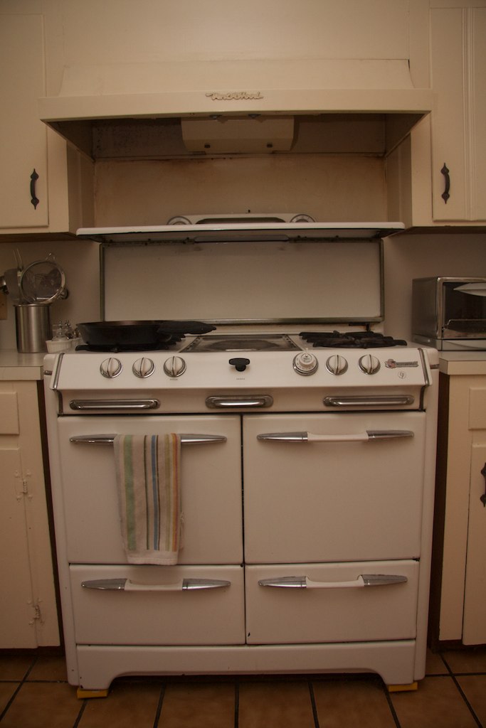 this stove is an old kitchen stove with two burners and one burner