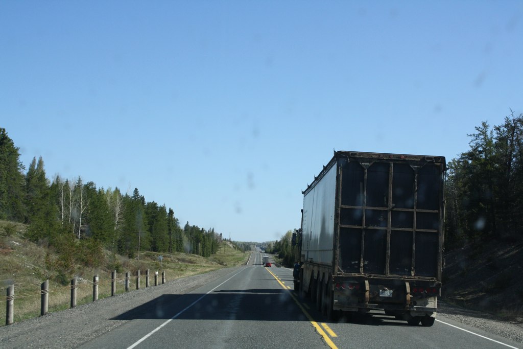 the truck is moving on the road in both directions