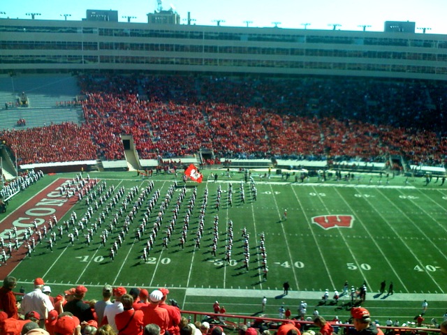 a marching band playing at an event in the stadium