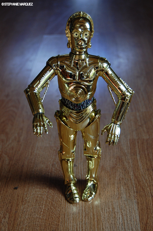 there is a gold figurine that has a light on