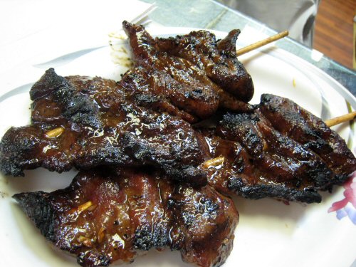 three different kind of grilled meat with a vegetable