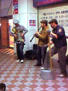 three men in police uniforms are playing music together