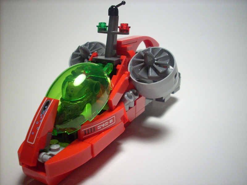 a red, green and yellow lego car is shown