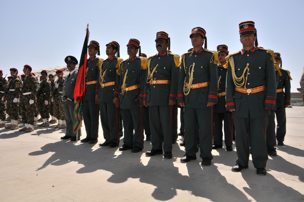 men in military uniforms stand in line next to each other