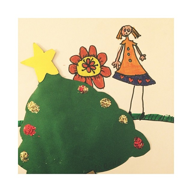 a child's drawing of a christmas tree and stars