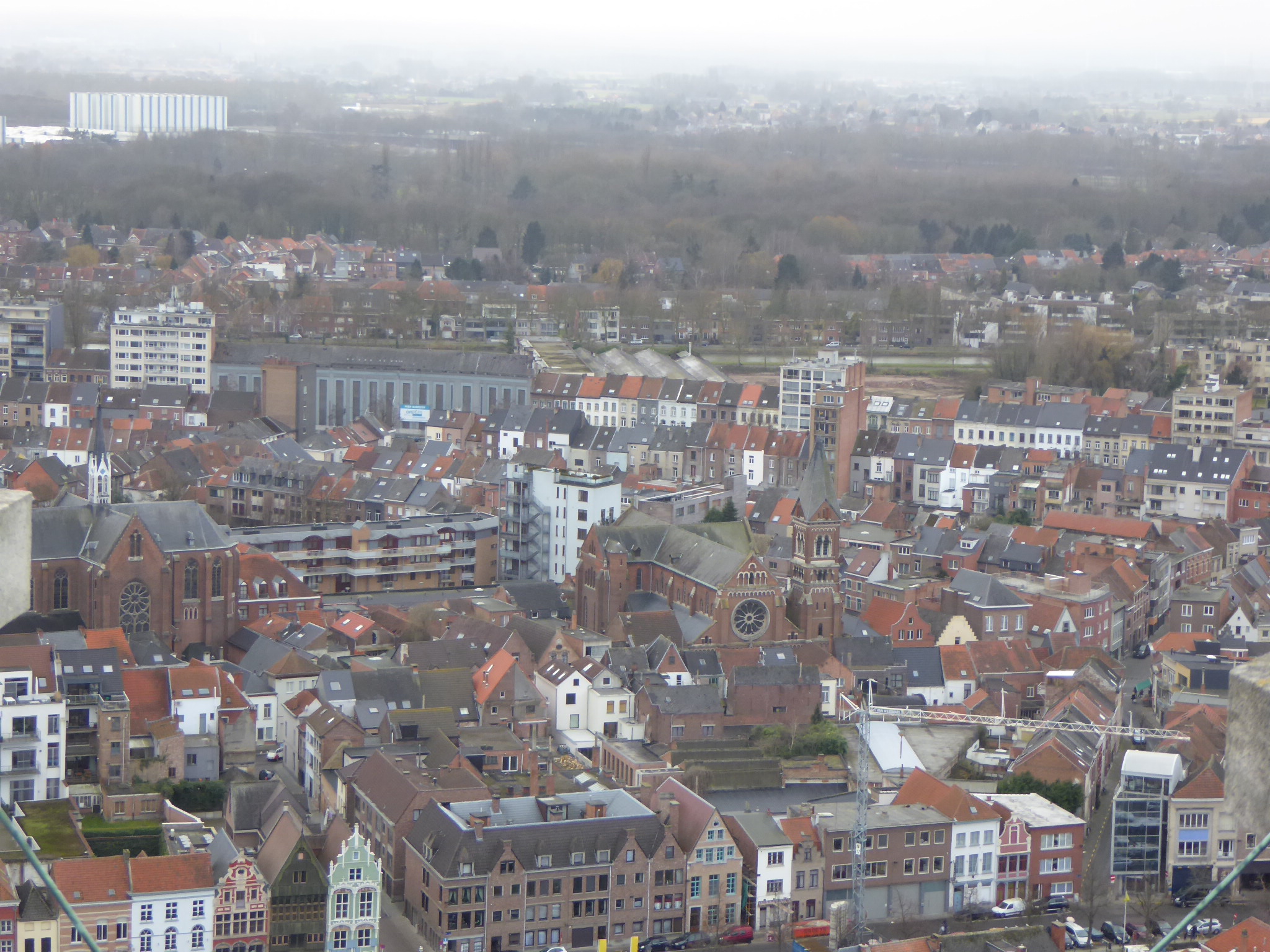 an overhead view of a large town with houses in the foreground