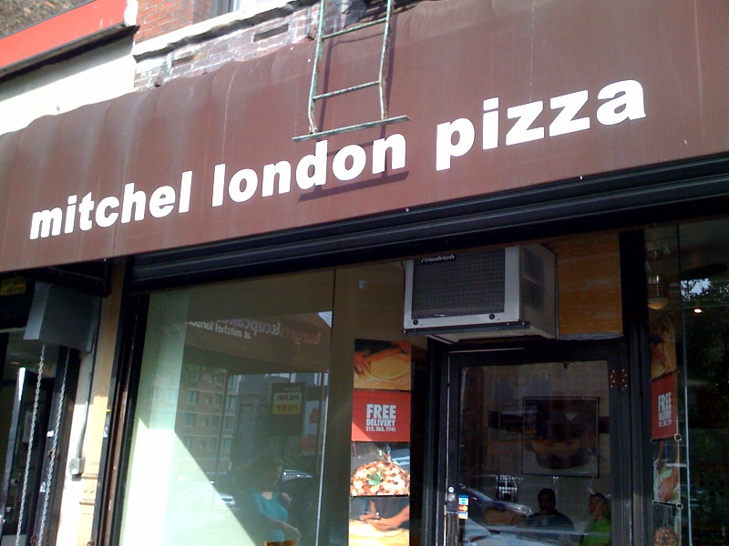 a storefront that has the word mitchell london pizza written on it