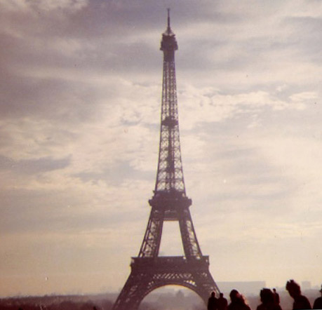 an old po of people watching the eiffel tower in paris