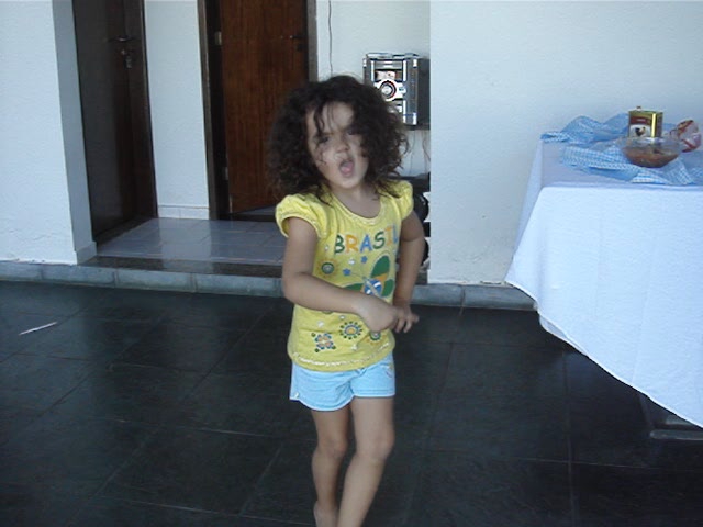 a child is standing on the floor playing