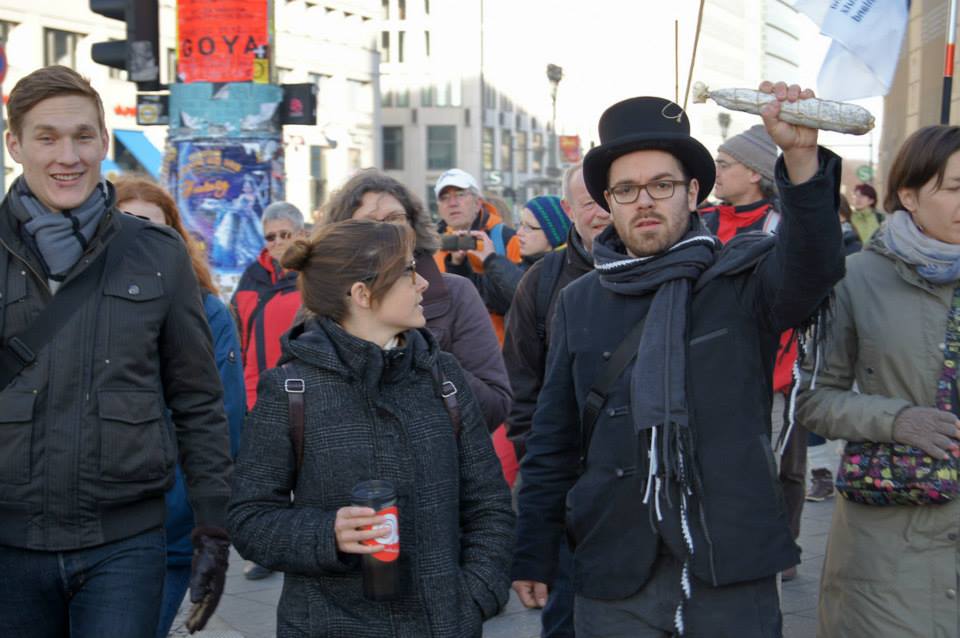 a group of people are standing together in the street