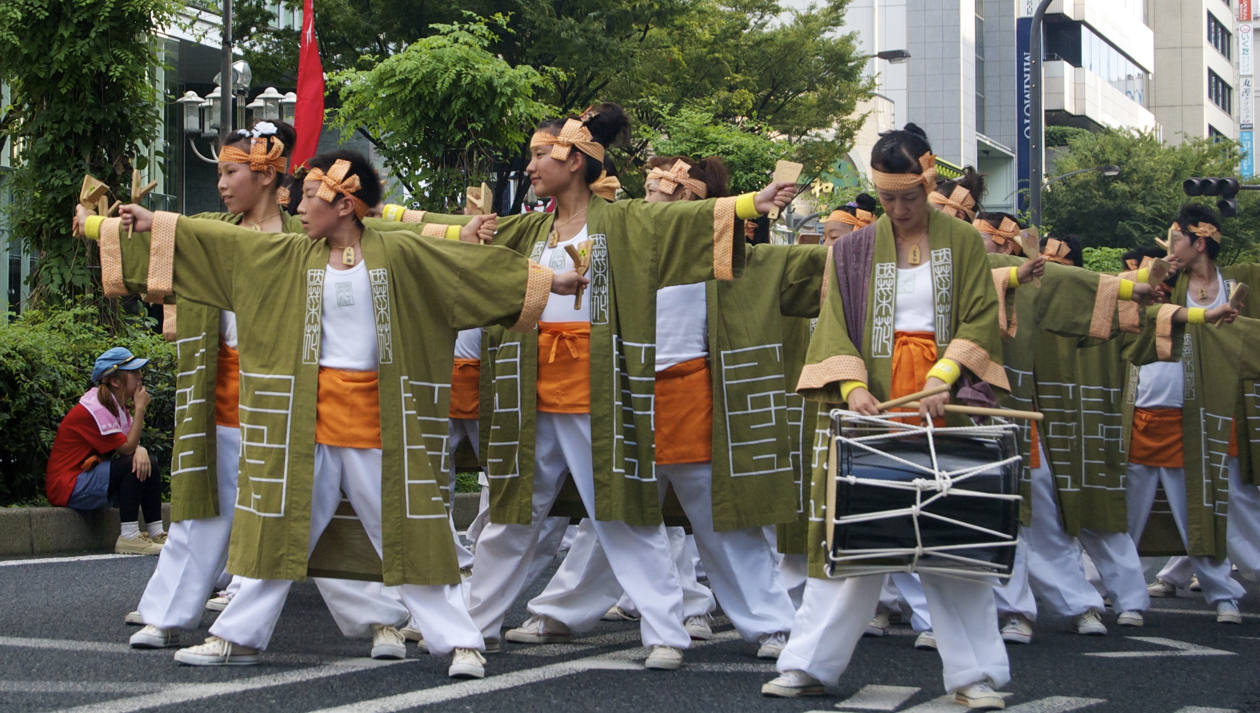 men in costumes with drumming sticks and drum drums