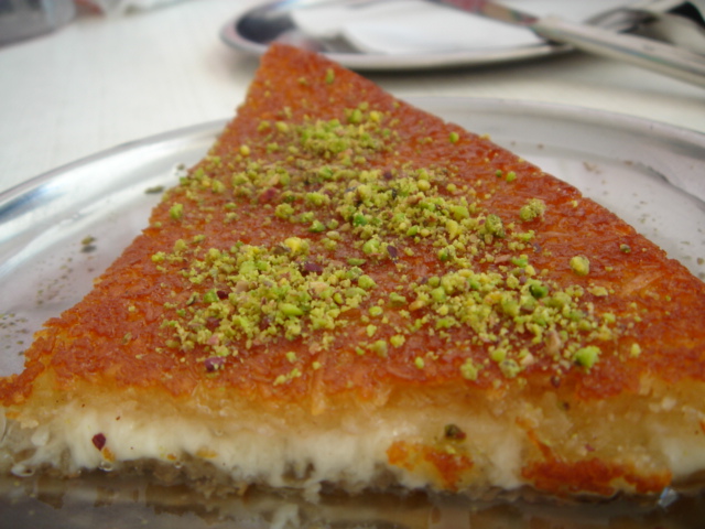 the slice of quiche is topped with seasonings on it