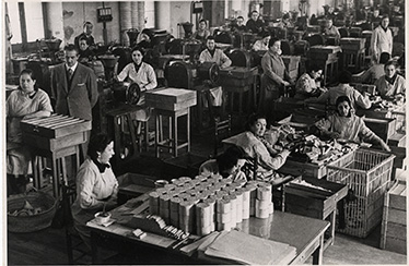workers at a sewing factory in the industrial district of london, england