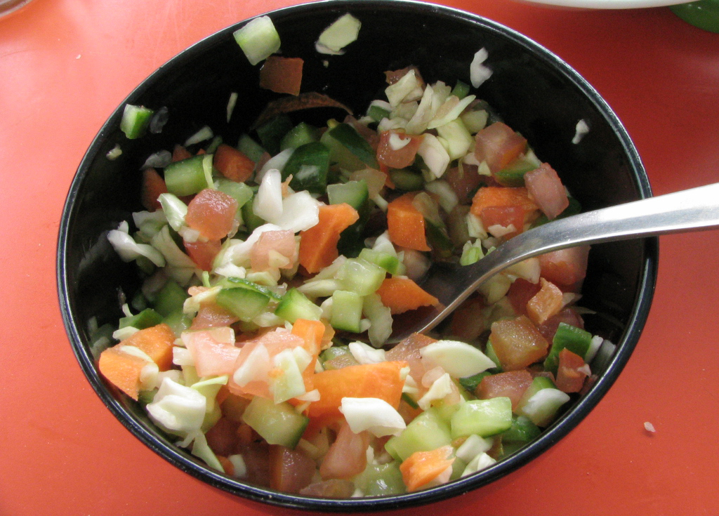 a bowl with some vegetables inside of it