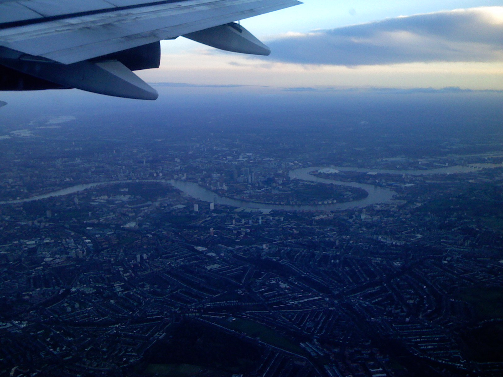 looking out an airplane window at the city and river