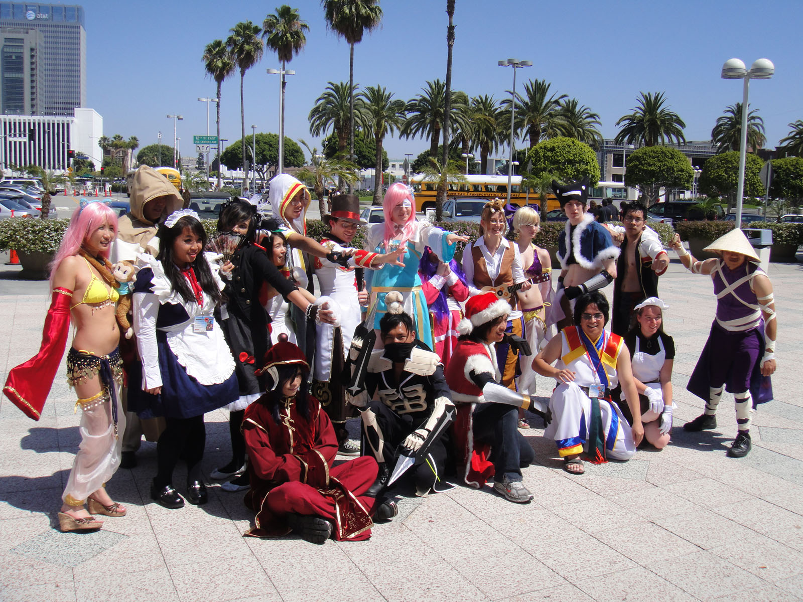 group of people with costumes pose for a picture