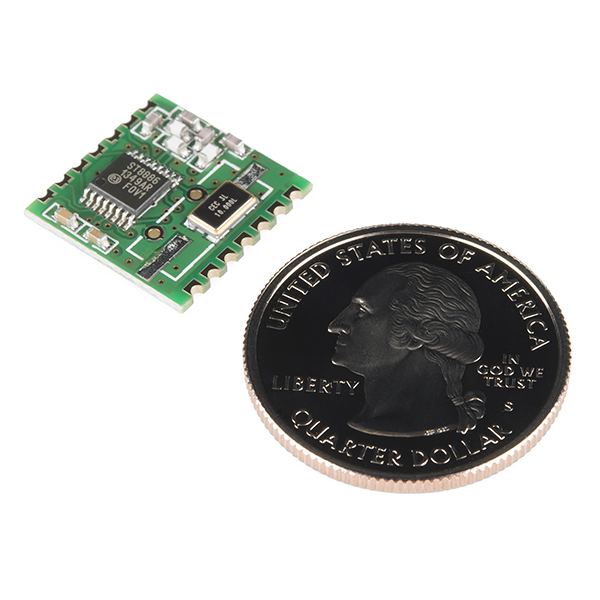 the coin with a micro blade is lying next to a small circuit board