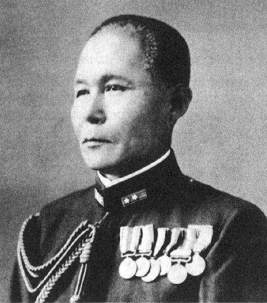 a man with a medals on his lap