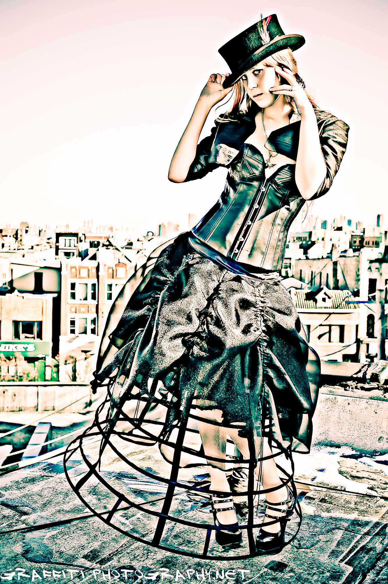 an artistic picture of a girl in an unusual dress on top of the roof
